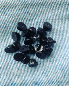 Rubber pin backs